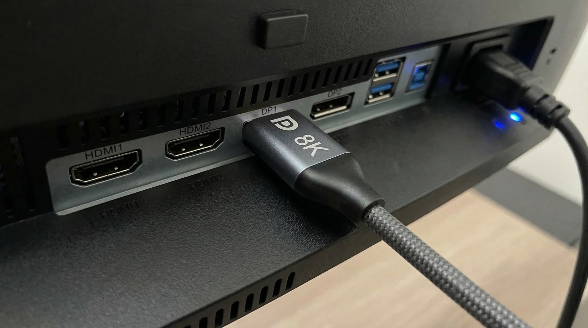 Cyberguys! braided display cable connected to a monitor